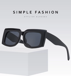 Detail of wide temple design on black square chunky sunglasses with Simple Fashion text