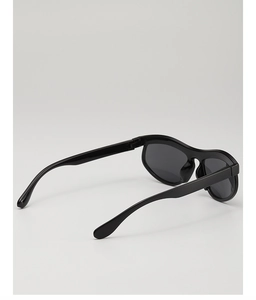 Detail view showing black wavy frame sunglasses for kids with durable smooth resin temples