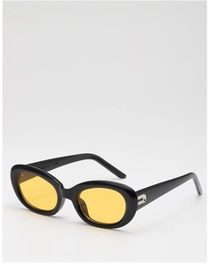 Macro shot of retro oval sunglasses with thick black frame and yellow tinted lenses