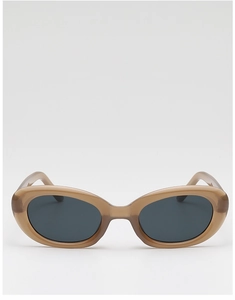 Macro shot of retro oval sunglasses with caramel frames and dark grey lenses for sun protection