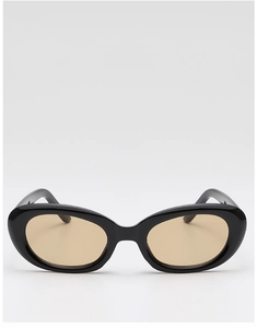 Detail view of oval retro sunglasses with black glossy frames and amber tinted lenses