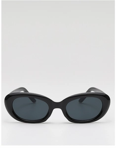 Detailed view of vintage black oval cat-eye sunglasses with polished frames and dark grey lenses