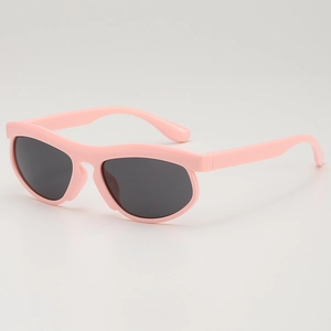 Modern pink round frame sunglasses for kids with dark grey lenses in a minimalist style