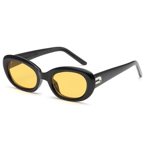 Retro oval sunglasses with thick black frame and transparent yellow lenses, 45-degree view