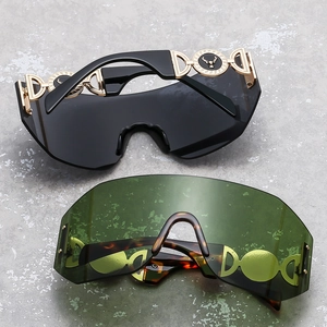 Frameless oversized cycling sunglasses with metallic deer head and gold D-ring accents