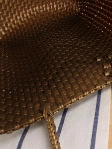 Large woven tote bag in dark brown with textured wave pattern and sturdy handles