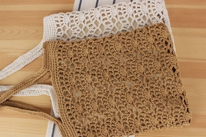 Detailed macro view of cream and tan handmade crochet tote bags with hollow diamond patterns