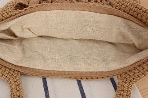 Close-up of handmade crochet bag with high-quality linen lining and secure zipper closure