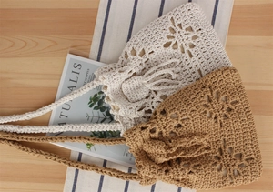 Detailed macro of floral crochet drawstring bags in beige and light brown cotton rope