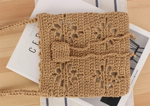 Detail of hand-woven cotton rope bag featuring hollow floral crochet patterns