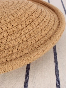 French vintage handwoven semi-circle straw handbag featuring a detailed spiral texture