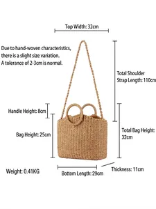 Handmade woven tote bag with round handles and shoulder strap in natural straw