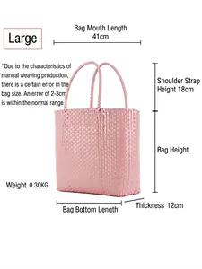 Pink macaron woven plastic handbag with double handles shown in a large size perspective