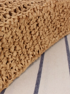 Minimalist hand-woven straw bag for women featuring intricate light brown texture details