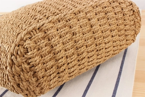 Close-up of natural paper rope weaving texture on a French vintage style beach tote bag