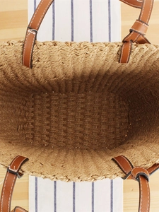 French vintage straw woven tote bag with brown leather handles for summer beach vacations