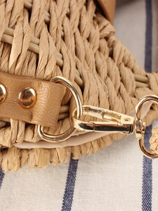 Handwoven straw bag with premium brown leather strap and gold-tone metal hook detail