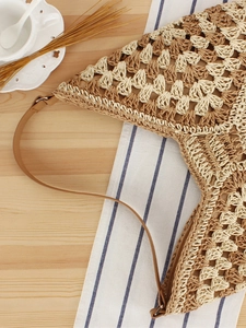 Large capacity woven straw shoulder bag with leather straps and hollow diamond pattern