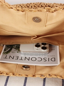 Handwoven shoulder bag with interior cotton lining, magnetic clasp, and inner pockets