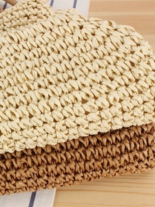 Handmade woven straw shoulder bag with textured herringbone pattern for summer vacations