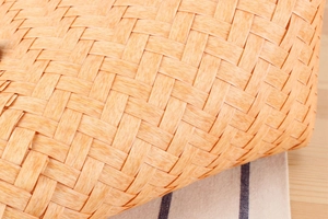 Detailed macro view of the woven plastic bamboo pattern and natural fiber texture