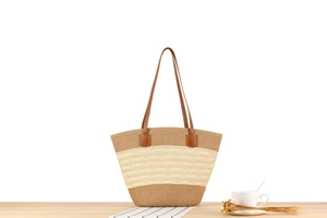Detail of hand-woven striped tote bag with brown leather handles and wavy texture
