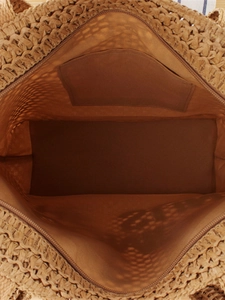 Brown hand-woven straw tote bag with zipper closure and spacious interior lining