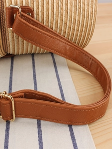 Fashionable cylinder woven paper rope bag with premium leather strap and gold metal buckle