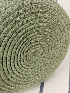 Green paper rope woven handbag with minimalist texture and detailed spiral stitching craft