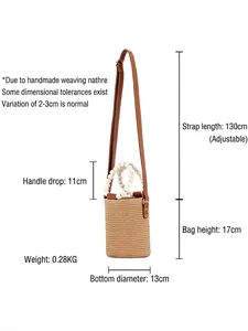 Minimalist straw woven bucket bag with beaded handles and adjustable leather strap