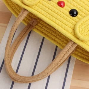 Yellow cotton woven tote bag with cartoon patterns and brown braided handles for women