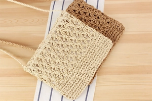 Detailed flat lay of handmade hollow woven paper rope shoulder bags in beige and brown