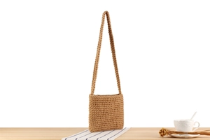 Close-up of woven cotton rope texture on this oatmeal square crossbody bag
