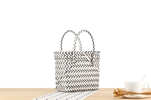 Detailed view of black and white chevron weave pattern on a handcrafted tote basket bag