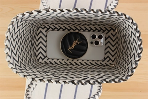 Interior view of chevron handwoven tote bag holding a smartphone and accessories