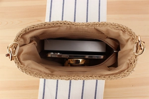 Internal view of the paper rope woven bag showing large capacity and zipper pockets