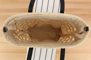 Top view of woven beach tote showing spacious interior, lining and zipper pocket