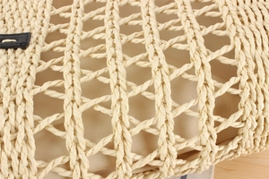 Macro shot of hand-woven hollow mesh texture with premium inner lining and leather trim