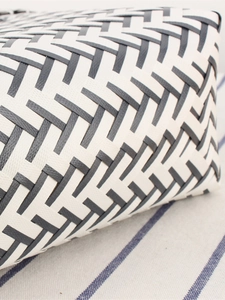 Handwoven plastic basket bag with black and white stripes for storage and bathroom use