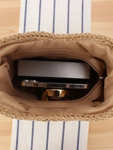 Straw woven shoulder bag with amber acrylic chain and interior storage layout