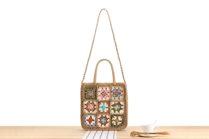 Detailed close-up of handmade crochet pattern on Bohemian style woven shoulder bag