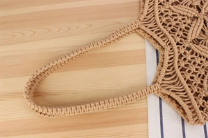 Detailed macro view of beige cotton rope Macrame weave and handle on bohemian tote bag
