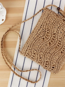 Sac bandoulière en paille tissé main avec pompon et perles en bois pour la plage