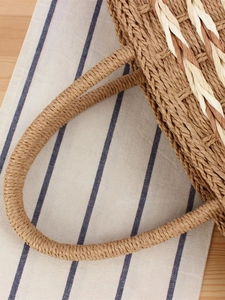 Handcrafted woven straw tote bag with round handles for summer beach vacations and daily use