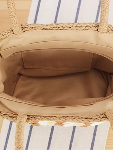 Large woven straw tote bag featuring interior zipper pocket and fabric lining