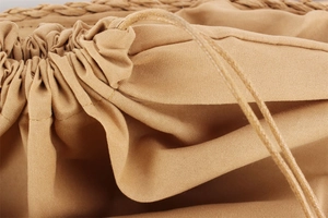 Detailed macro view of the khaki cotton drawstring liner and sturdy woven texture