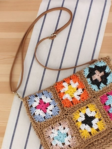 Handmade bohemian crochet crossbody bag with colorful floral granny square patterns