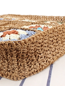 Bohemian granny square crochet crossbody bag with brown woven straw texture detail