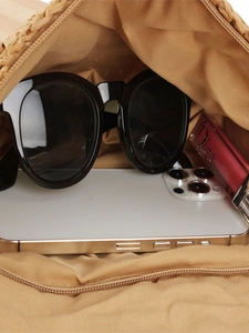 Retro woven straw shoulder bag interior view with large capacity for sunglasses and phone