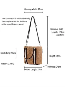 Minimalist straw woven bucket bag with dimensions and adjustable shoulder strap shown